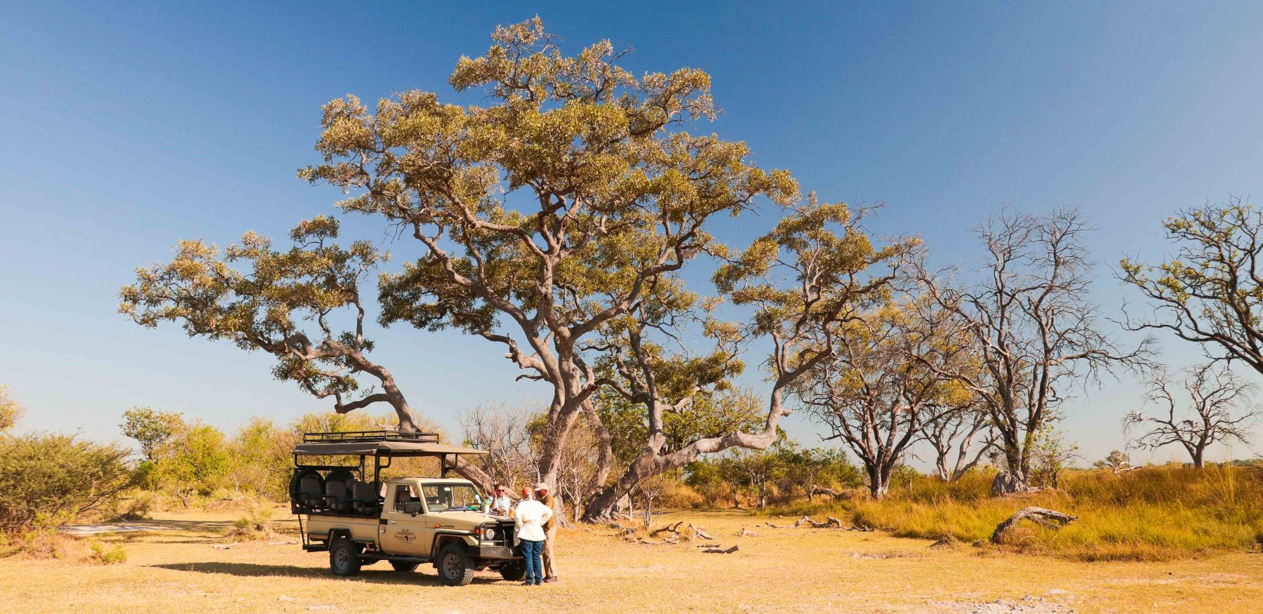 Safari vehicle briefing guests in Botswana